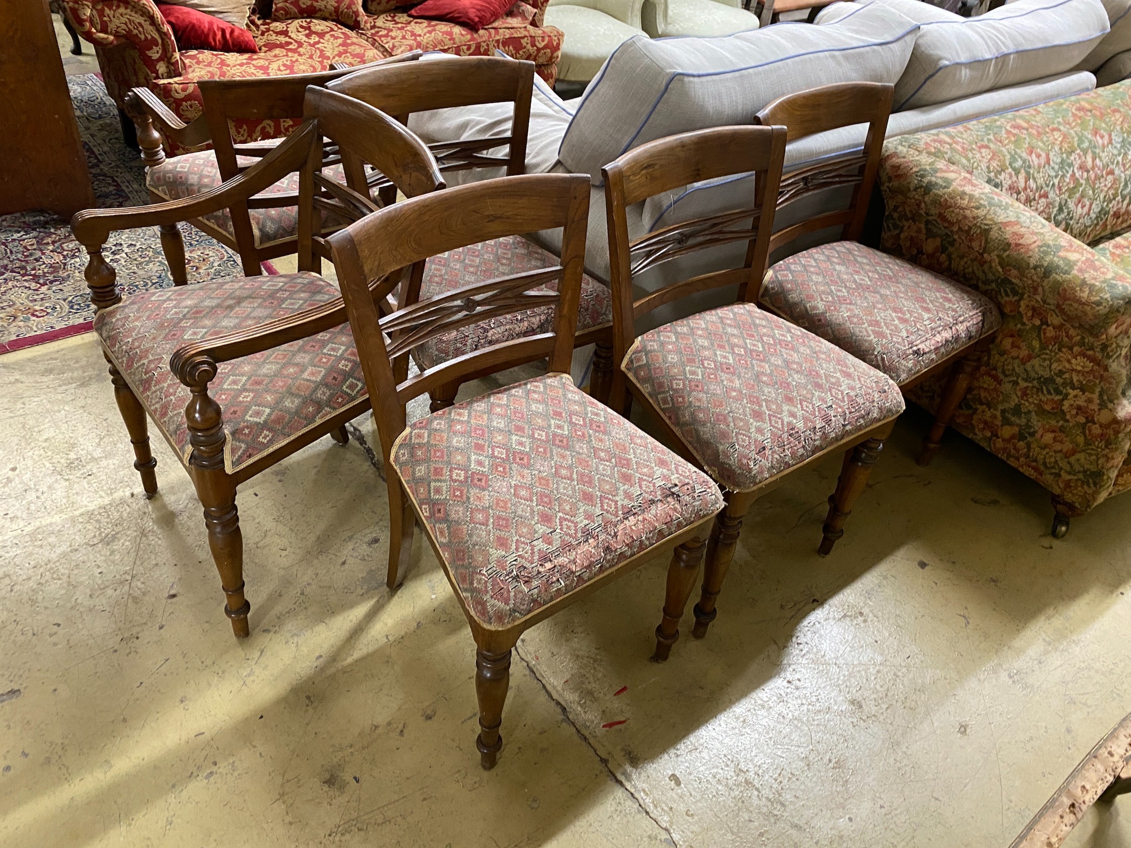 A set of six Indonesian hardwood dining chairs, two with arms